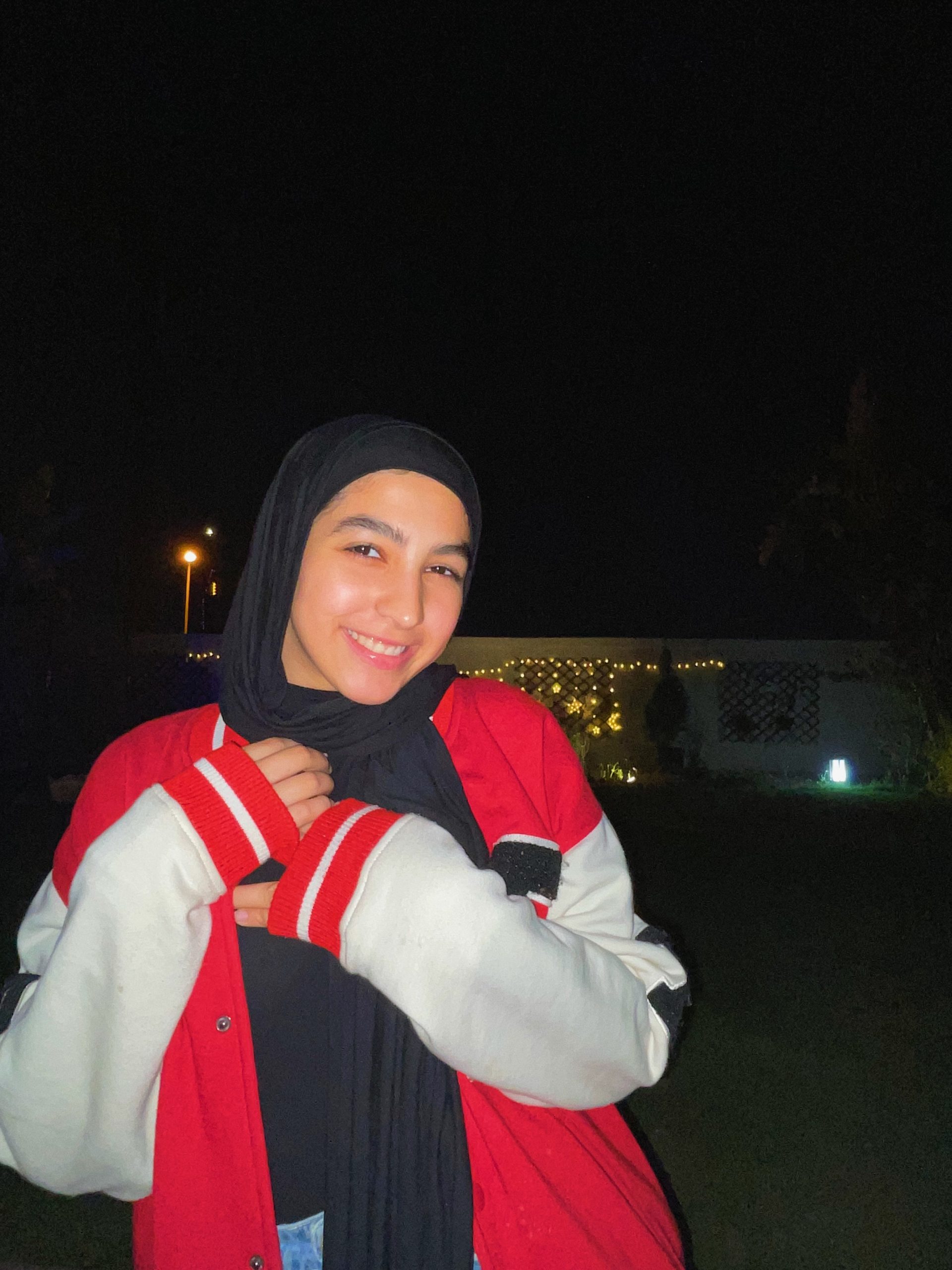 Mariam Badr smiling at night